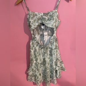 small green and white floral summer dress with cut out
